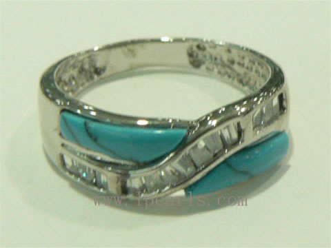 X shape 925 silver ring with turquoise ornament on it