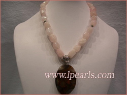 Rose quarts jewelry necklace with a faceted crystal as a pendant