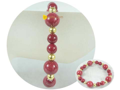 7.5" red gemstone bracelet with golden ball